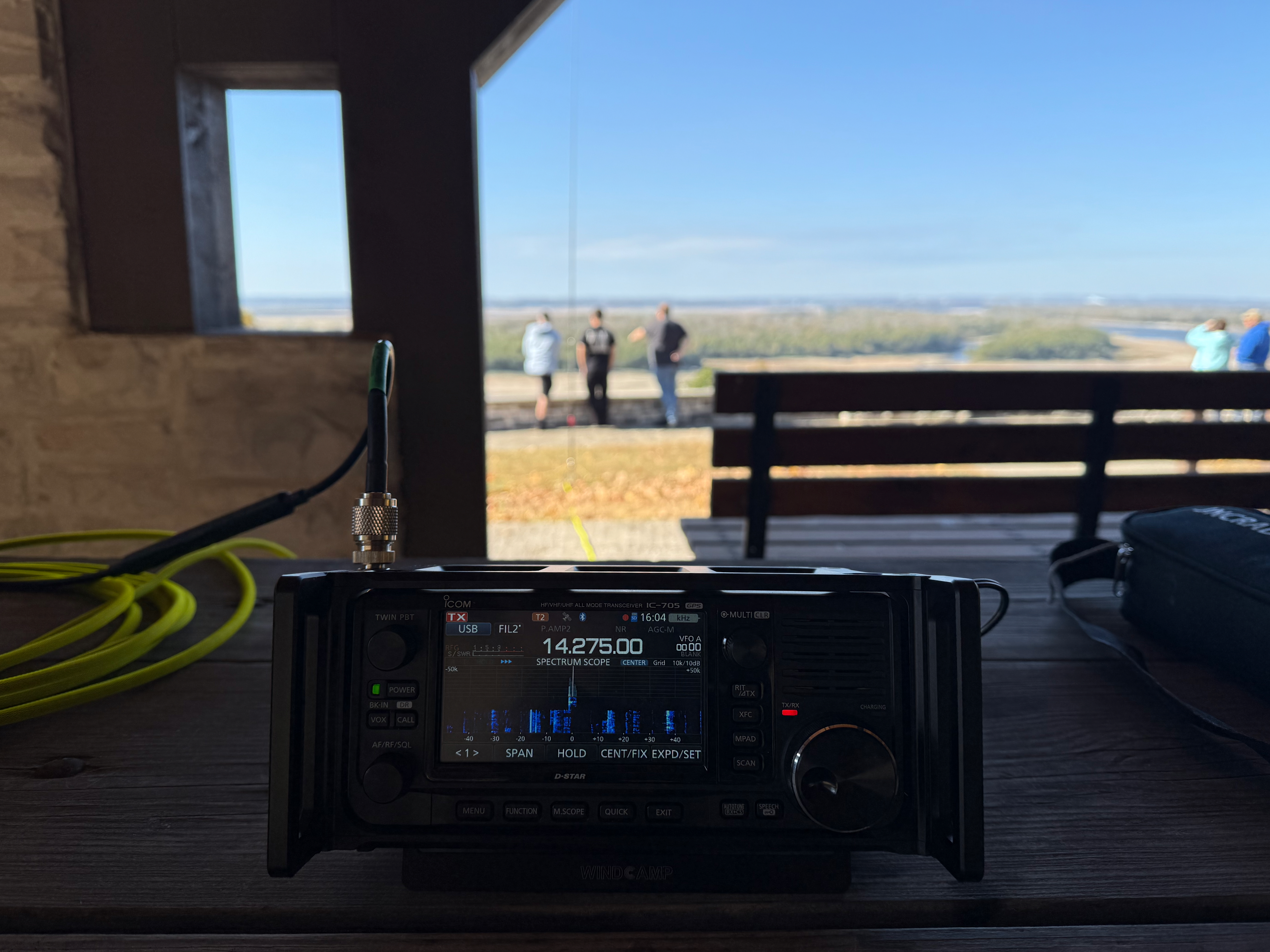 The view from the park bench under the shelter I operated at. An Icom IC-705 in the foreground and the Mississippi River and open view of the horizon further west.