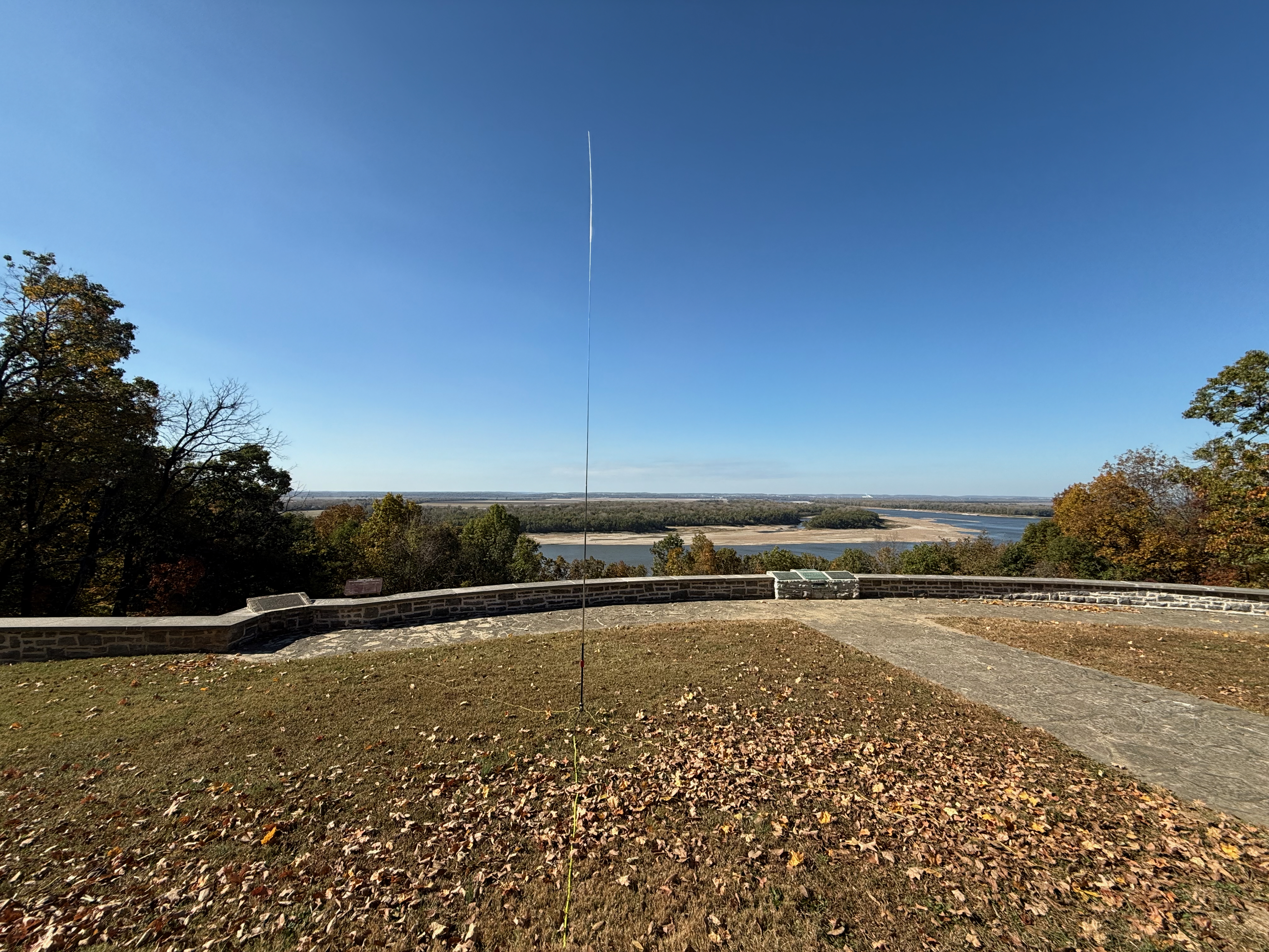 The overlook from the shelter where the old fort used to be. Overlooking the bluffs with the horizon towards the west and the Mississippi River. A vertical antenna is visible in the foreground with the yellow coax snaking towards the camera.