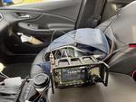 My IC-705 setup in my car. The radio is on the center arm rest and my backpack is in the passenger seat.