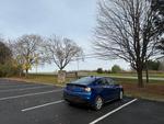 My car parked at Clifton Gorge. In the background is the park sign that reads 'Clifton Gorge State Nature Preserve'.